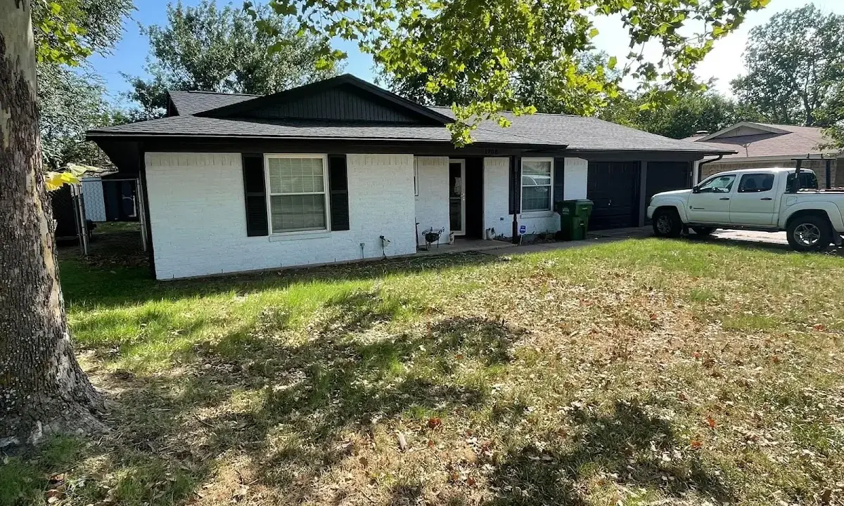 Professional roofing crew working on a residential roof in Millcreek